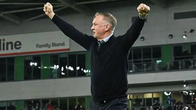 Michael O'Neill celebrates with his arms raised as his side score a second goal during the World Cup 2026 qualifier match between Northern Ireland and Slovakia