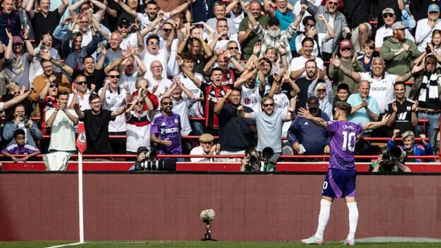 Tom Cairney celebrates with fans 