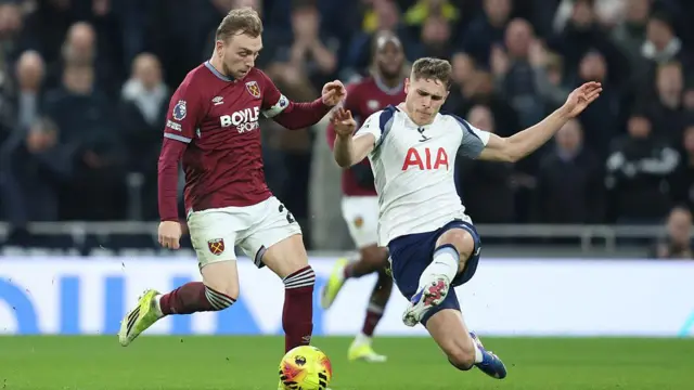 Jarrod Bowen of West Ham and Tottenham's Micky van de Ven