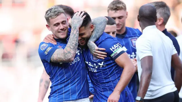 Sammie Szmodics and Sam Morsy celebrate following Ipswich Town's 1-1 draw with Southampton