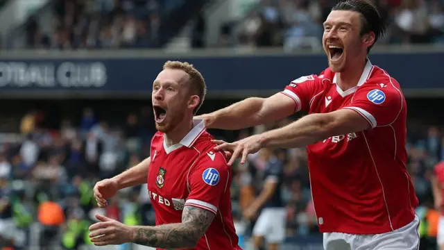Lewis O'Brien and Kieffer Moore celebrate a goal when playing for Wrexham