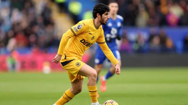 Goncalo Guedes of Wolverhampton Wanderers runs with the ball during the Premier League match between Leicester City FC and Wolverhampton Wanderers FC at The King Power Stadium