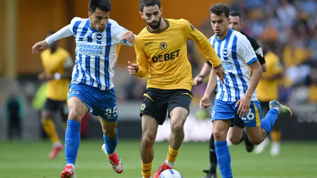 Rayan Ait-Nouri of Wolverhampton Wanderers is challenged by Diego Gomez and Yasin Ayari 