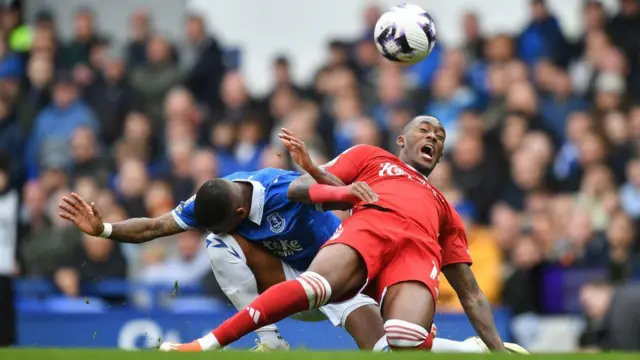 Callum Hudson-Odoi tackled by Ashley Young