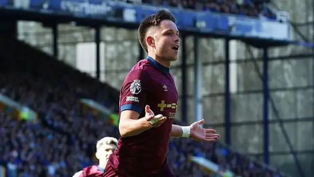 George Hirst holds out his hands as he celebrates scoring against Everton