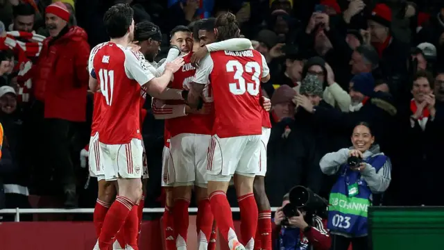 Arsenal players celebrating against Bayern 