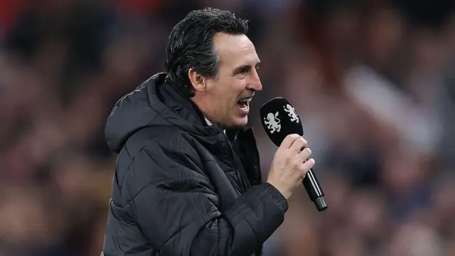 Unai Emery talks to the Villa fans after the game using a microphone