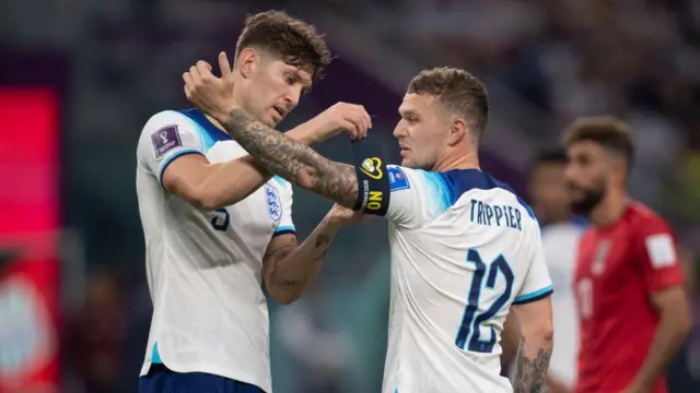  John Stones of England puts the captain's armband on team mate Kieran Trippier