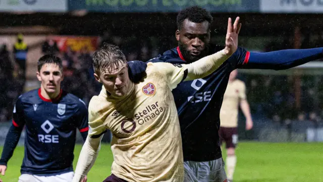 Hearts' Blair Spittal and Ross County's Michee Efete