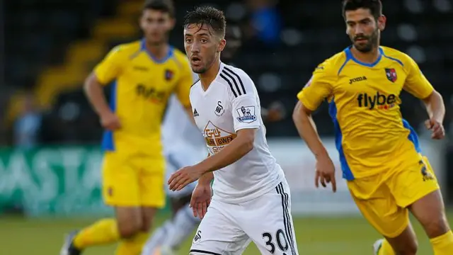 Josh Sheehan in action for Swansea in 2014