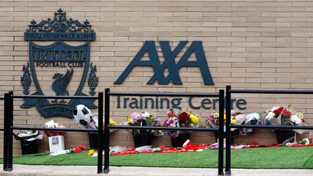 Flowers and tributes outside Liverpool's AXA Training Centre