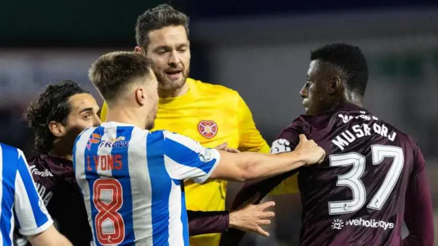  Hearts' Musa Drammeh (R) and Kilmarnock's Brad Lyons (C) have an argument at full time during a William Hill Premiership match between Kilmanock and Heart of Midlothian at Rugby Park,