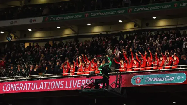 Liverpool lift the EFL Cup following victory over Chelsea.