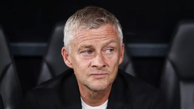 A close-up of Ole Gunnar Solskjaer watching a game from the dugout