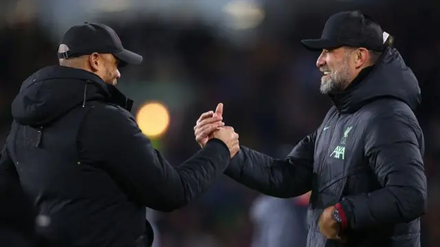 Burnley manager Vincent Kompany shakes hands with Liverpool manager Jurgen Klopp