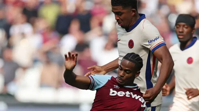 West Ham's Crysencio Summerville tussles with Chelsea's Wesley Fofana