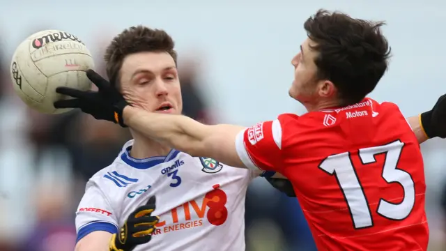 Monaghan defender Killian Lavelle and Louth's Daire McConnon battle for the ball