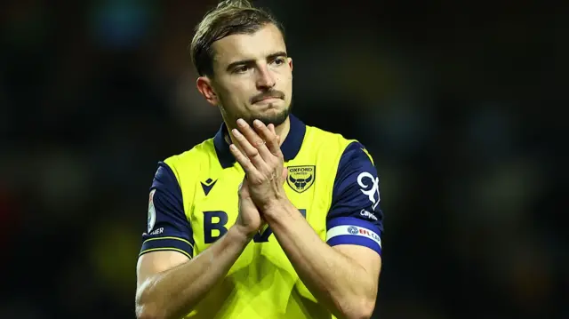 Oxford United's Michal Helik applauding supporters