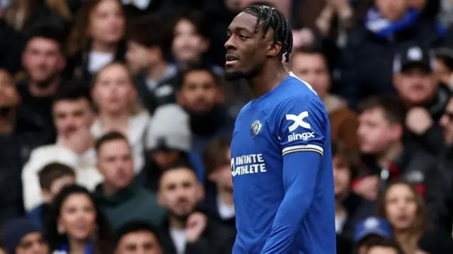 Chelsea's Axel Disasi looks on