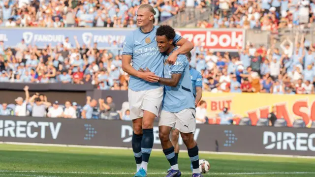 Erling Haaland celebrates with Oscar Bobb