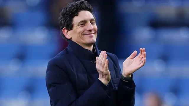 Keith Andrews, Manager of Brentford, applauds the crowd
