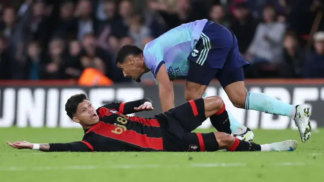 Arsenal's William Saliba fouls a Bournemouth player