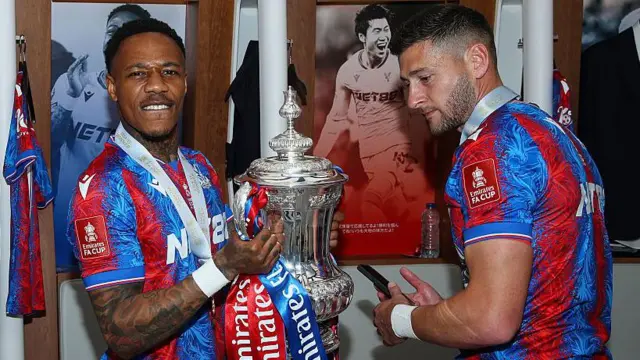 Nathaniel Clyne and Joel Ward of Crystal Palace celebrate with the FA Cup Trophy