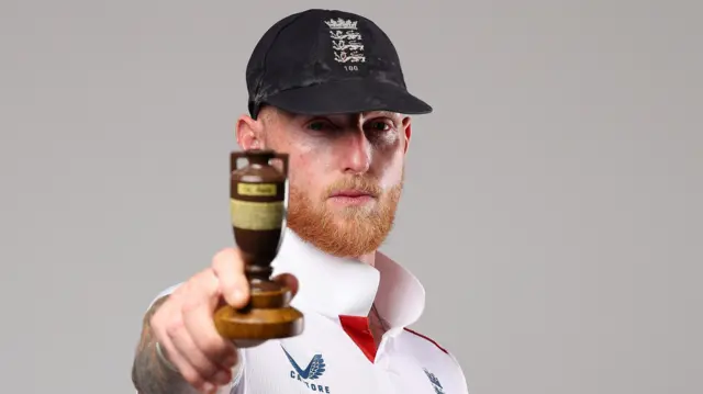 Ben Stokes poses with Ashes urn