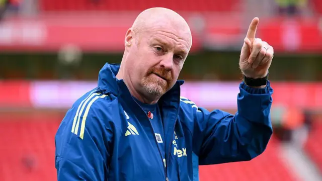 Sean Dyche points up