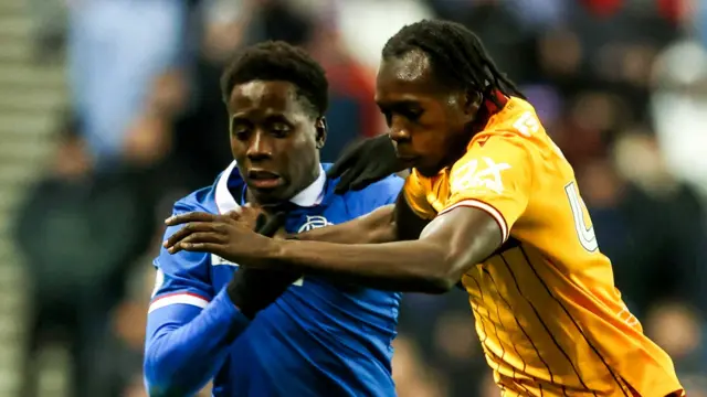 Rangers' Djeidi Gassama and Motherwell's Emmanuel Longelo 