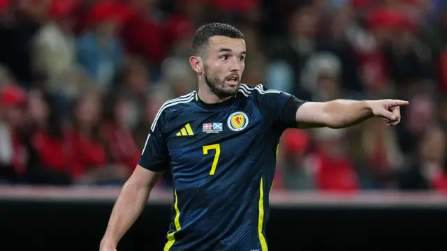 John McGinn in action for Scotland against Denmark