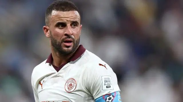 Kyle Walker wearing a white Manchester City strip