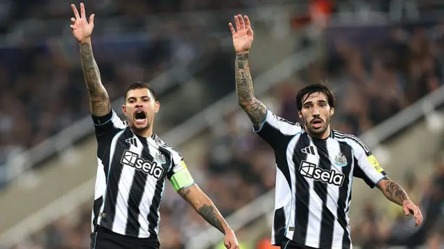 Newcastle's Bruno Guimaraes and Sandro Tonali with their hands raised