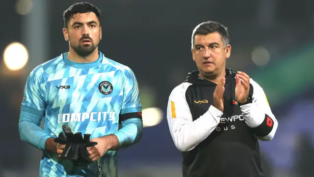 Newport manager Nelson Jardin and Goalkeeper Nick Townsend applaud the travelling fans at Tranmere