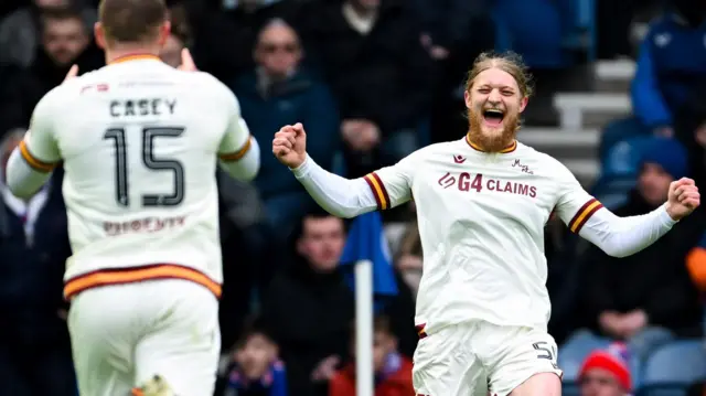 Luke Armstrong celebrates at Ibrox