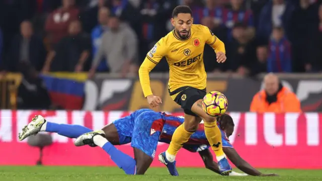 Matheus Cunha of Wolverhampton Wanderers runs with the ball under pressure from Trevoh Chalobah of Crystal Palace during the Premier League match between Wolverhampton Wanderers FC and Crystal Palace FC at Molineux