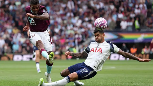Lyle Foster tackled by Romero 