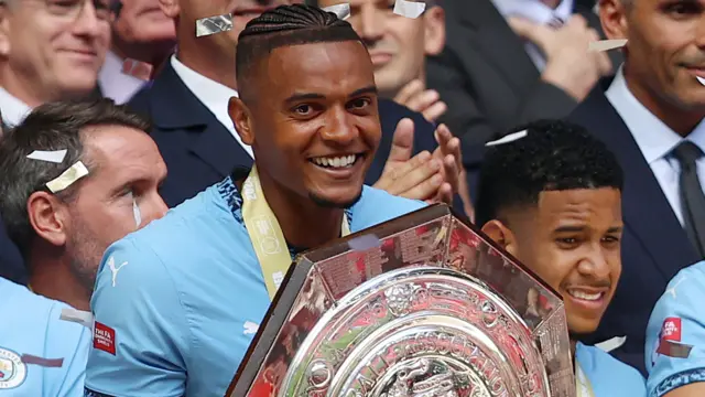 Manuel Akanji with Community Shield trophy