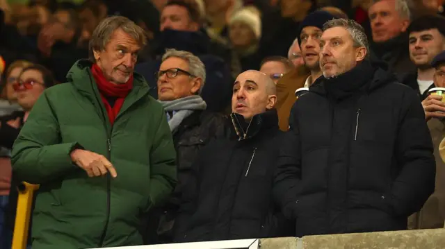 Manchester United co-owner Sir Jim Ratcliffe (L) chief executive Omar Berrada (C) and director of football Jason WIlcox (R)