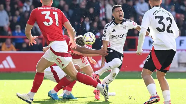 Andreas Pereira goes down after contact from Forest defender Murillo