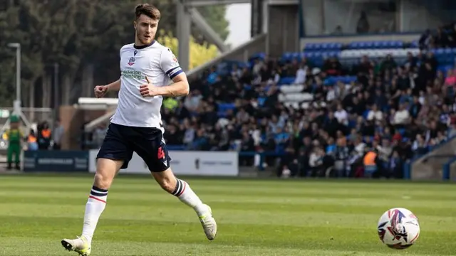 George Thomason in action for Bolton Wanderers