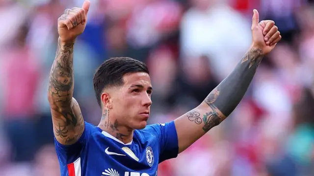Enzo Fernandez of Chelsea gives a thumbs up to the fans 
