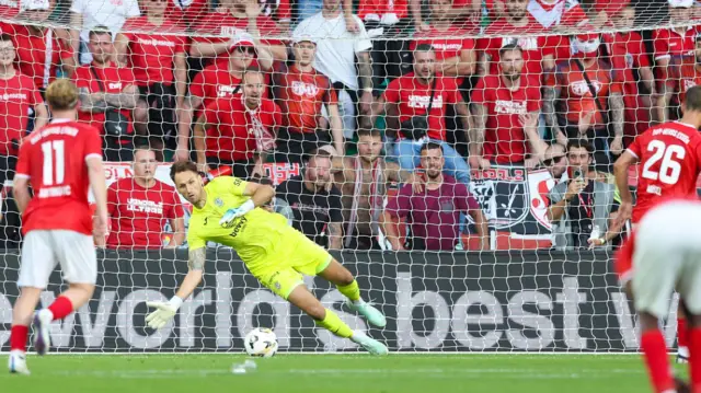 Hibs' Raphael Sallinger saves Torben Musel's penalty