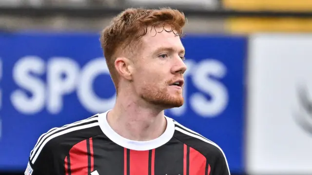 Fraser Bryden in Crusaders' red and black striped home shirt