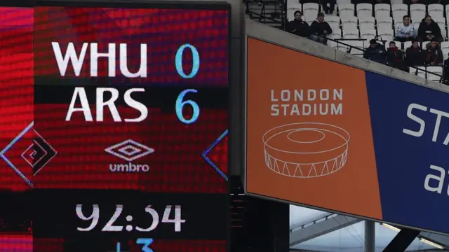 View of scoreboard showing "West Ham 0-6 Arsenal"