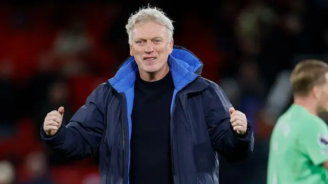 David Moyes gives a double thumbs-up at the final whistle and is smiling 