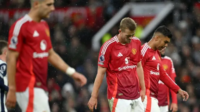 Matthijs de Ligt, Diogo Dalot and Casemiro look dejected during Manchester United's home defeat by Tottenham