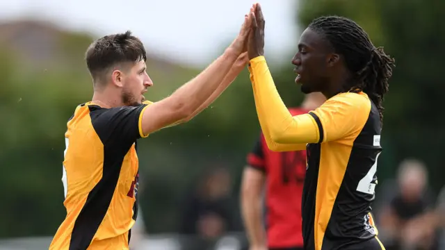 Anthony Glennon (left) celebrates after scoring for Newport against Undy