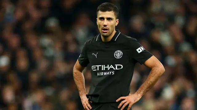 Rodri looks on with hands on hips during Manchester City match with Tottenham
