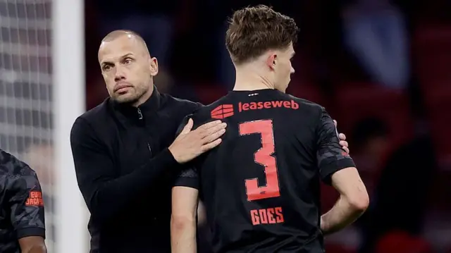 John Heitinga of Ajax congratulates Wouter Goes of AZ Alkmaar during the Dutch Eredivisie match between Ajax v AZ Alkmaar at the Johan Cruijff Arena 